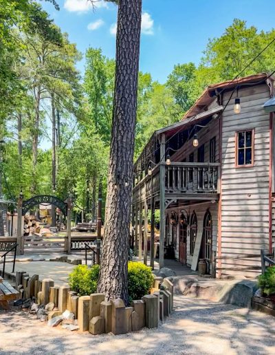 Wooden Western street and buildings among trees at Deadwood near Williamston, NC