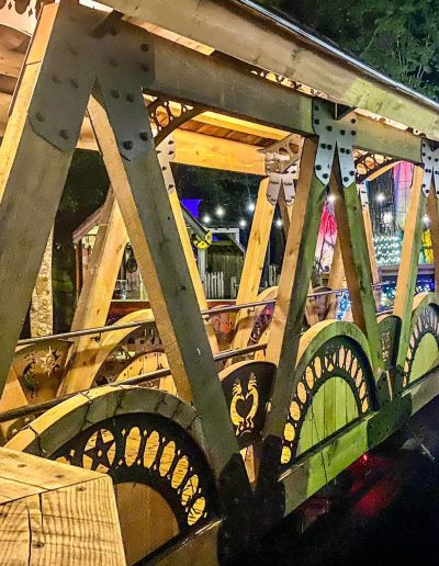 Timber bridge with decorative wheels and lights at Deadwood near Williamston, NC