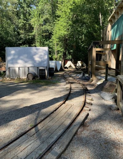 Narrow train tracks beside Western-style buildings at Deadwood near Williamston, NC