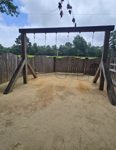 Wooden swing set inside the Deadwood playground near Williamston, NC