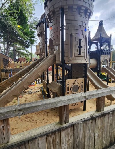 Wooden playground towers with a green spiral slide at Deadwood near Williamston, NC