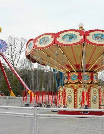 Decorated outdoor swing ride and hanging chairs at Frankie's of Charlotte in Huntersville, NC.