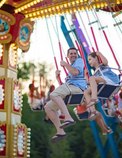 Riders enjoying the colorful swing ride at Frankie's of Charlotte in Huntersville, NC.