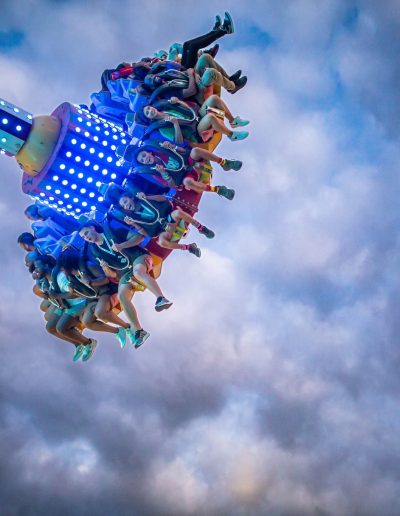 Illuminated Discovery ride high against the evening sky at Frankie's of Charlotte in Huntersville, NC.