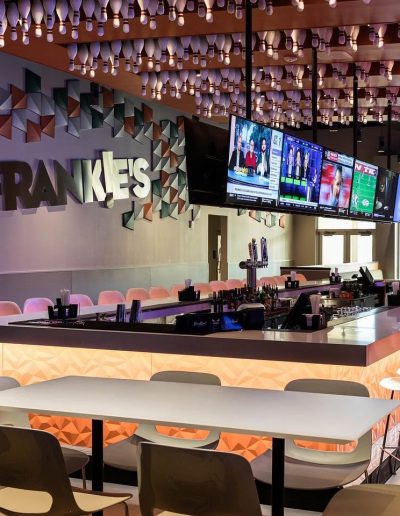 Frankie’s bar with stools and overhead televisions at Frankie's of Charlotte in Huntersville, NC.