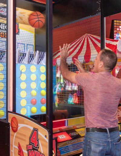 Visitors playing Connect 4 Hoops in the arcade at Frankie's of Charlotte in Huntersville, NC.