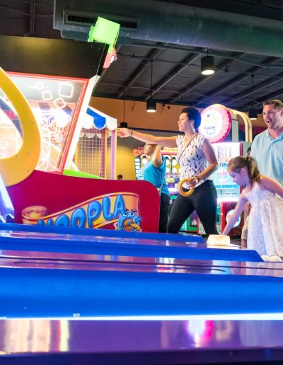 Group playing an arcade ball-rolling game at Frankie's of Charlotte in Huntersville, near Concord.