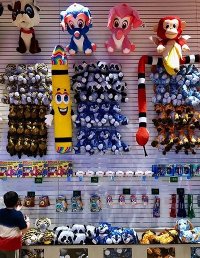 Arcade prize wall filled with plush toys at Frankie's of Charlotte in Huntersville, NC.