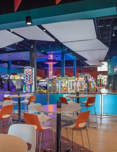Indoor café tables overlooking the arcade at Frankie's of Charlotte in Huntersville, near Cornelius.