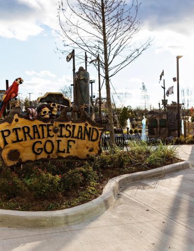 Pirate Island Golf sign and ship masts at Frankie's of Charlotte in Huntersville, NC.