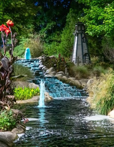 Waterfalls and blue fountains beside mini-golf landscaping at Frankie's of Charlotte in Huntersville, NC.