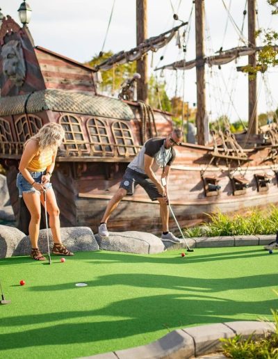 Players putting beside a pirate ship at Frankie's of Charlotte in Huntersville, NC.