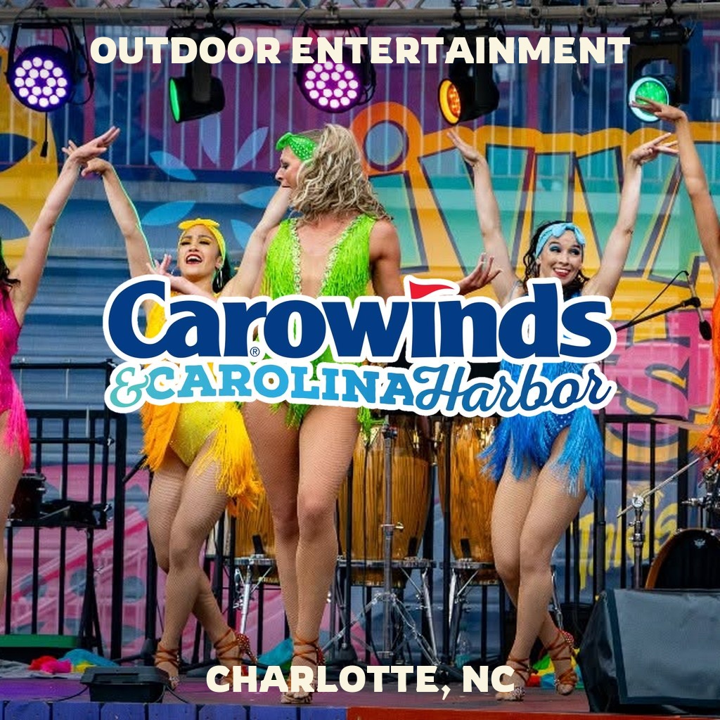 Outdoor entertainment at Carowinds in Charlotte, NC, with dancers and Carowinds logo